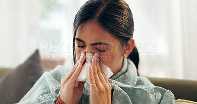 Buy stock photo Woman, home and sinus with blowing nose on illness, flu and sick in living room on sofa. Female person, sneeze and couch in lounge with blanket for fever, virus and allergy with tissue for infection