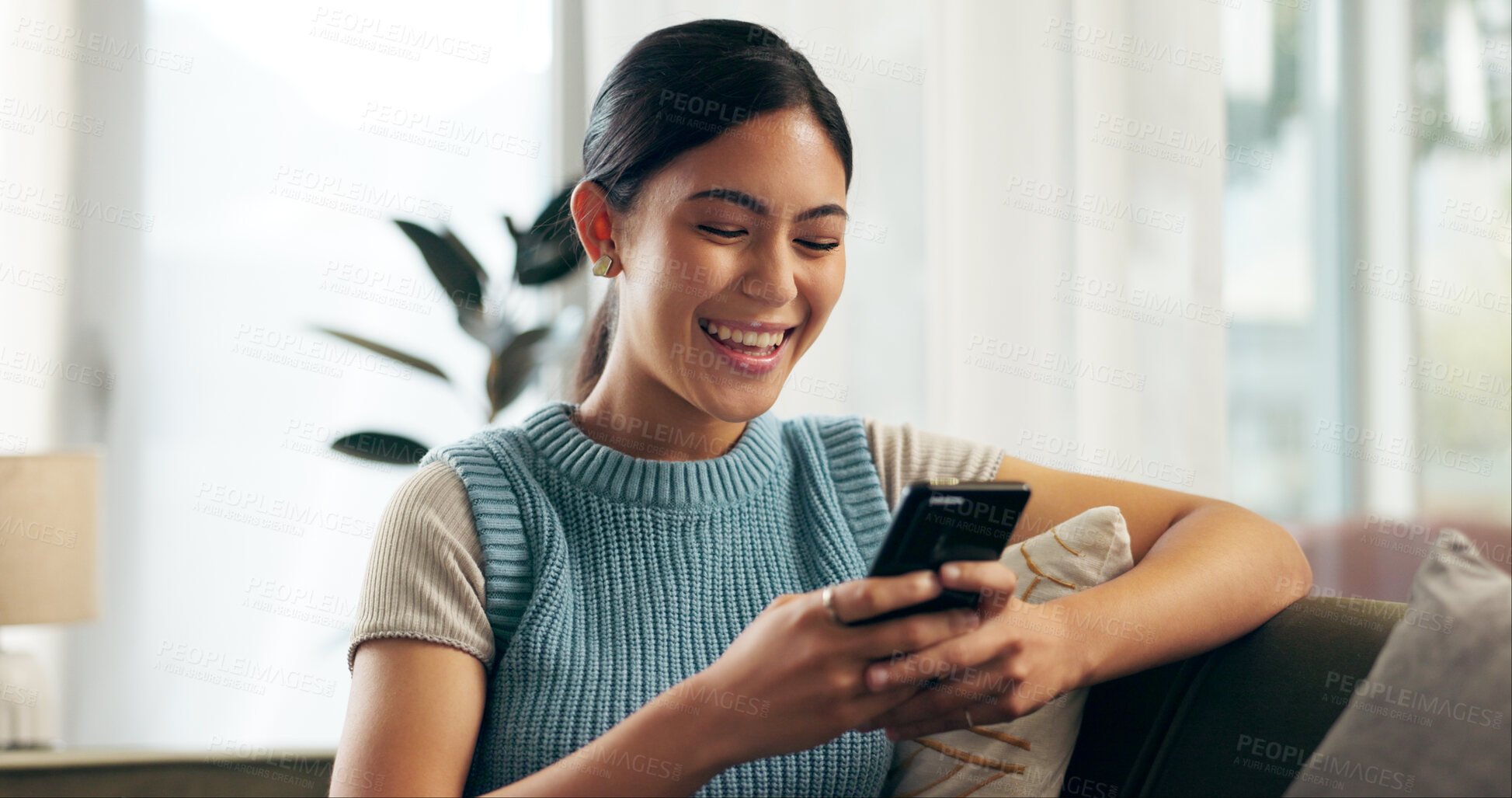 Buy stock photo Girl, smartphone and excited in house on sofa for notification, achievement and news by email with smile. Female person, mobile and happy in living room for reward or offer for university scholarship