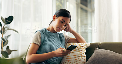 Buy stock photo Stress, online and woman with mobile on sofa for bad news, relationship issues or notification in living room. Scroll, smartphone and person with for conflict, internet gossip or social media in home