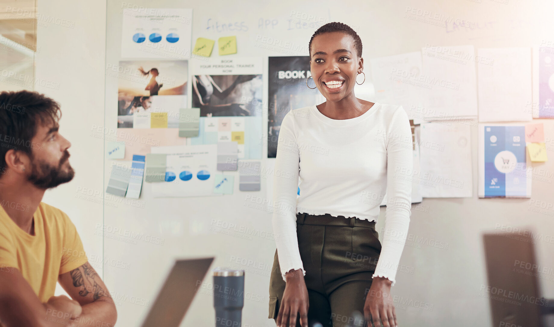 Buy stock photo Shot of a young businesswoman delivering a presentation to colleagues in a modern office