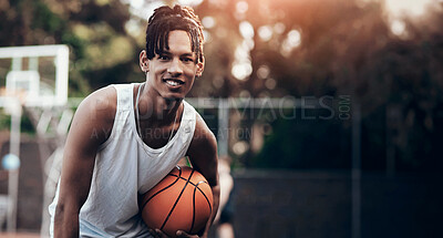 Buy stock photo Portrait of a sporty young man standing on a basketball court