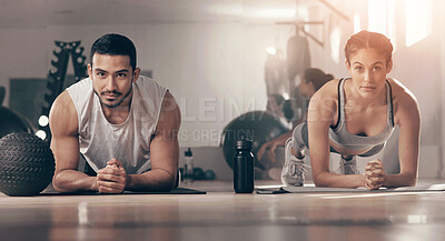 Buy stock photo Shot of two young athletes working out together at the gym