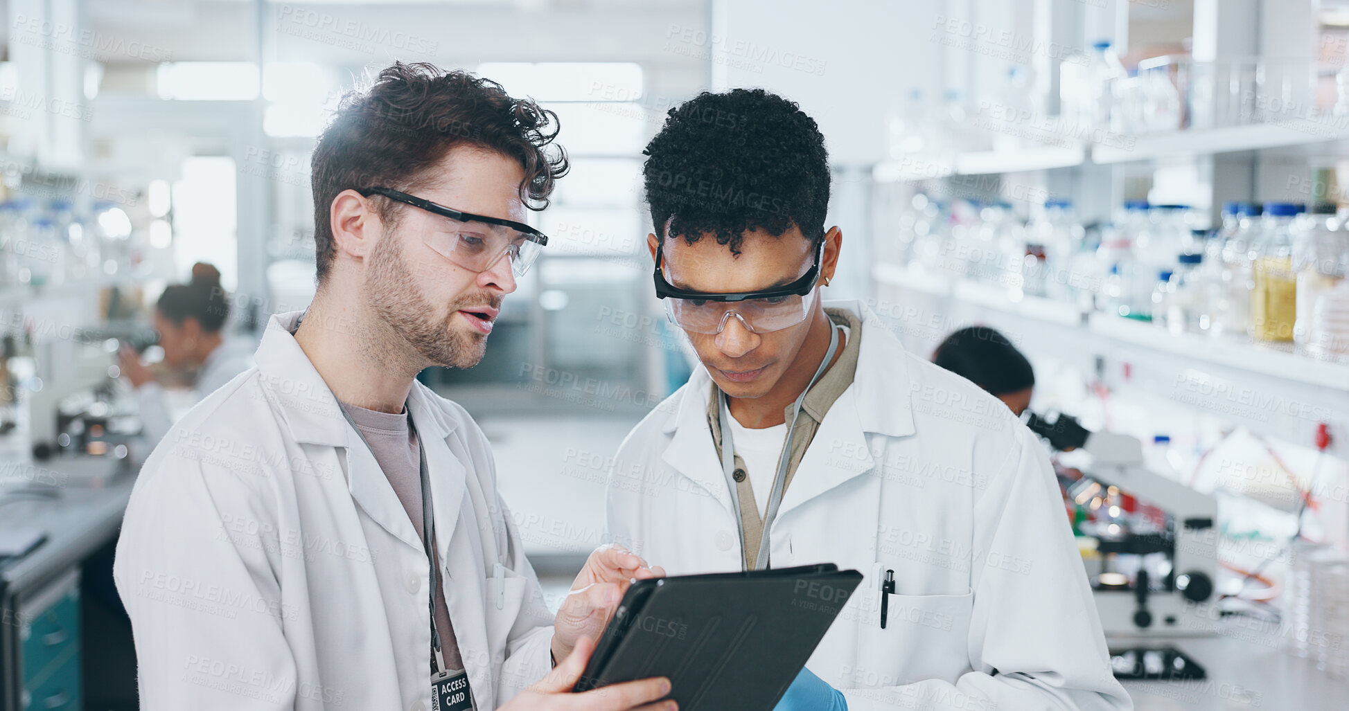 Buy stock photo Tablet, team and scientists in laboratory with research for pharmaceutical innovation experiment. Collaboration, discussion and male medical science students on digital technology for biology data.