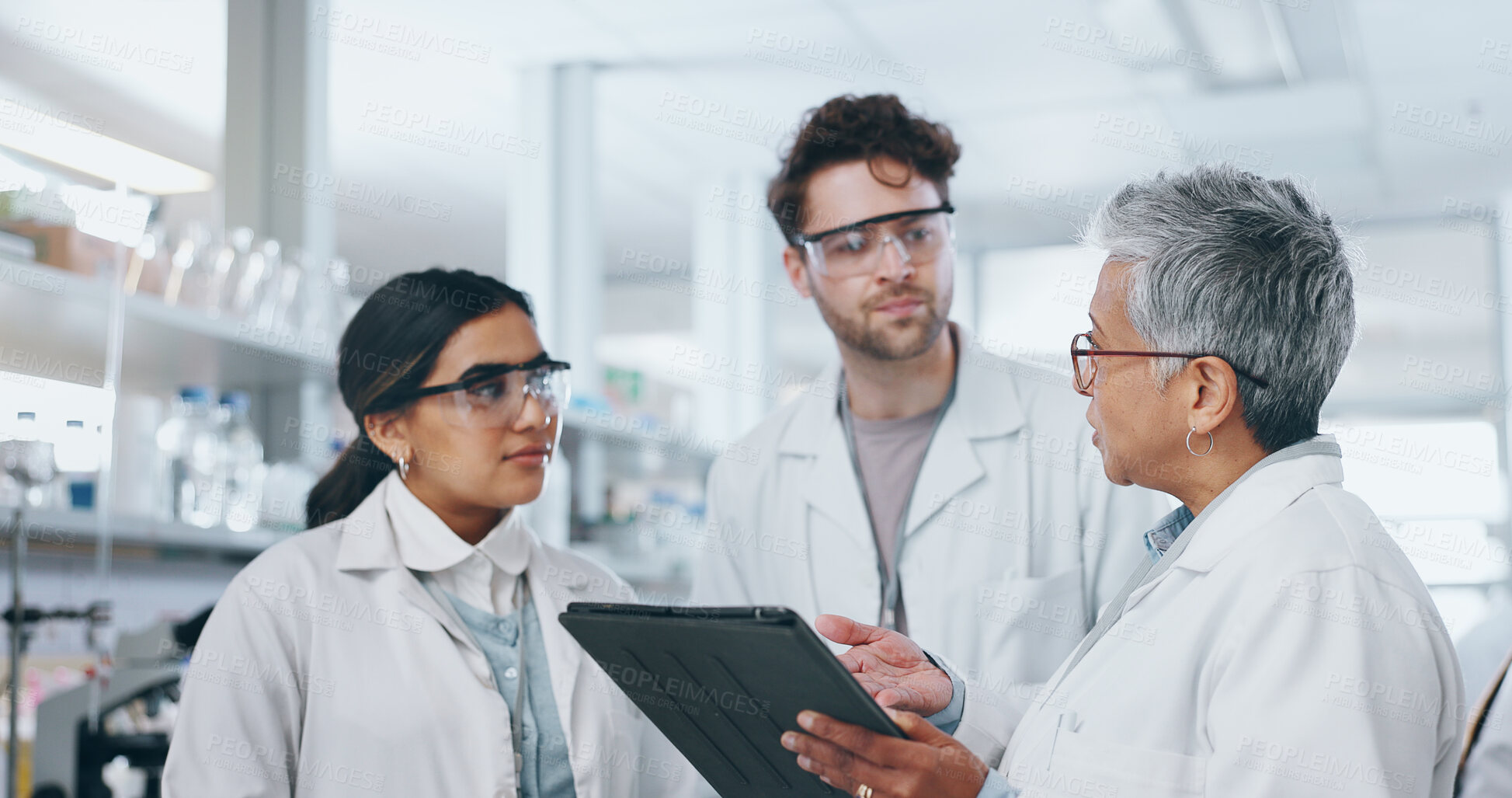 Buy stock photo Science, research team and tablet discussion in lab, professional scientists and project for vaccine development. Talking, people and together for innovation medicine, microbiology and collaboration