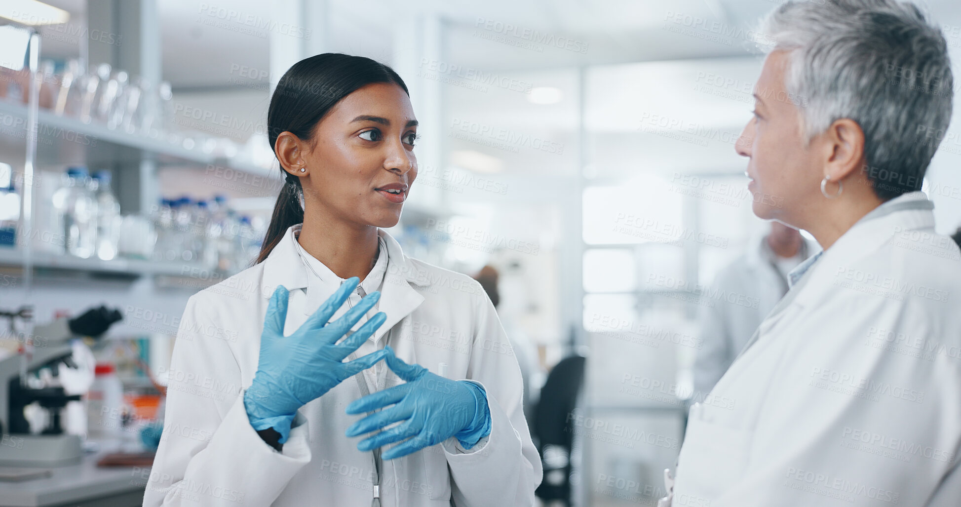 Buy stock photo Women, scientist and chat in lab for medical study or feedback on test investigation and results. Coach, intern and discuss for science research on internship program with teamwork or collaboration