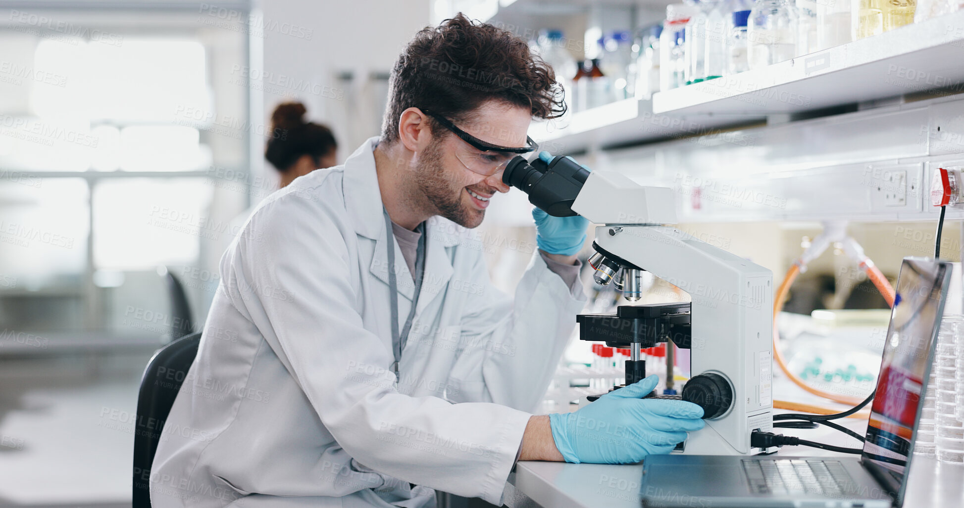 Buy stock photo Medical, research and man with microscope, biotech and check experiment for cancer treatment. Person, scientist and employee with lab equipment, vaccine and cure development with forensic particles