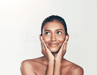 Buy stock photo Shot of a beautiful young woman posing against a white background