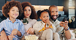 Black family, woman and man with children, watch and embrace in living room, movies and love in house. Lounge, mom and dad with kids, relax and smile for care, comfort and snack for film in home