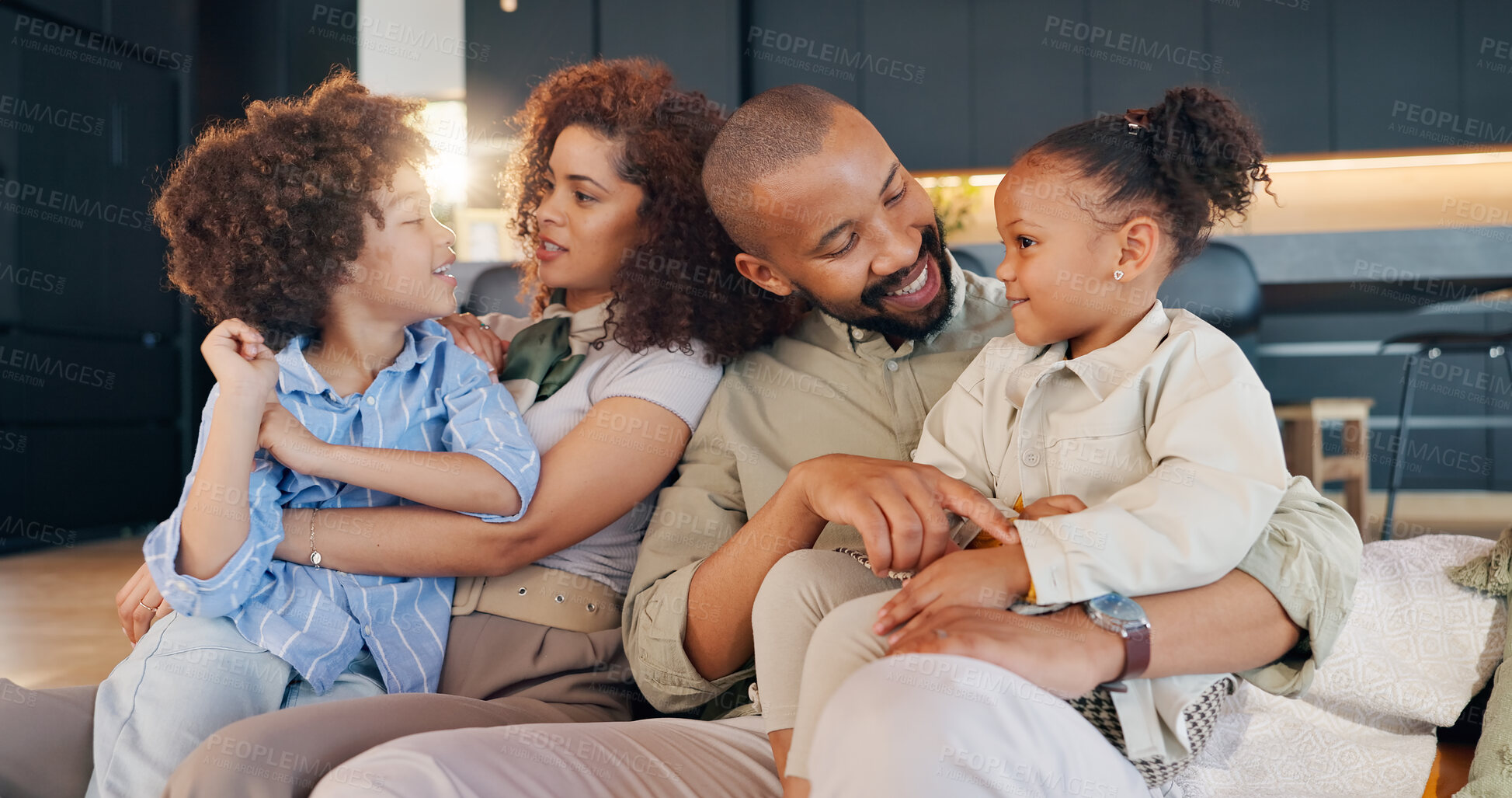 Buy stock photo Family, children and hug in home on sofa, parents and love for unity and support together in living room. Bonding, trust and married people in lounge, smile and embrace with relax on couch on weekend