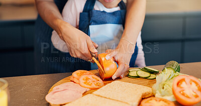 Buy stock photo Hands, sandwich or prepare food with child for development, learning or nutrition at home. Kid, parent or help with knife to cut tomato for lunch, education or growth with fresh produce for health