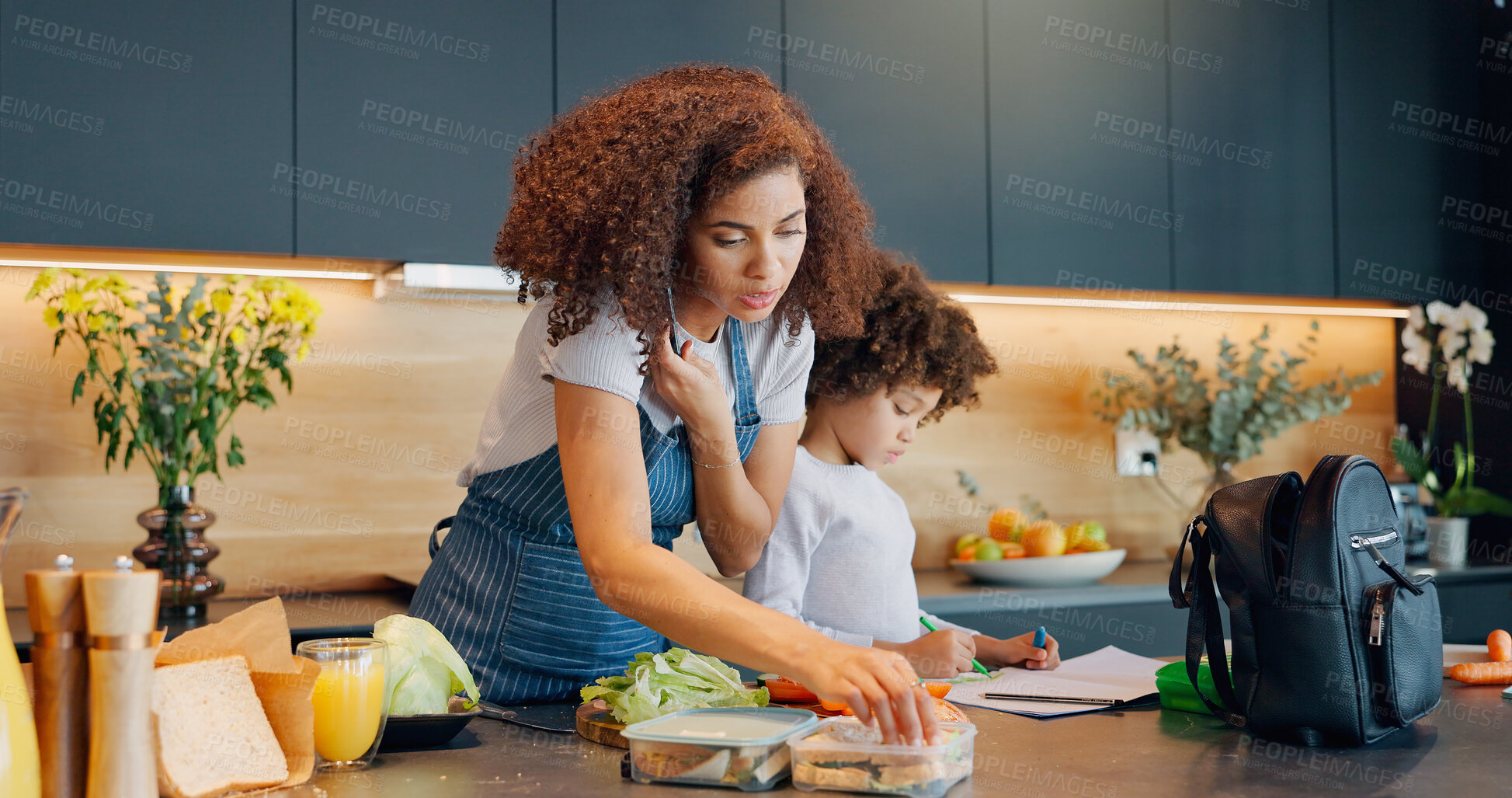 Buy stock photo Multitask, phone call and woman in kitchen with child, packing lunch and routine in morning. Mother, kid and talk on mobile in home for communication, care and healthy meal for son in kindergarten