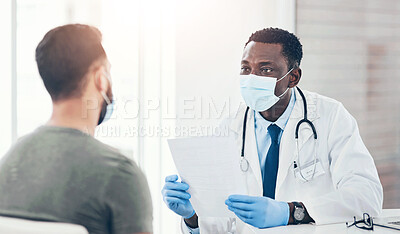 Buy stock photo Shot of a masked doctor having a consultation with a man