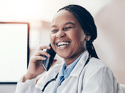 Buy stock photo Shot of a young doctor talking on a cellphone