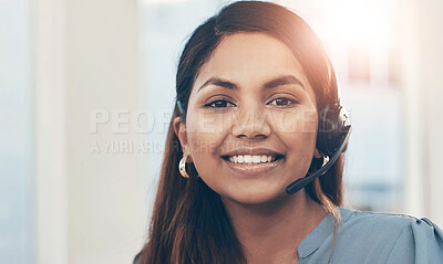 Buy stock photo Portrait of a young businesswoman wearing a headset while working in an office