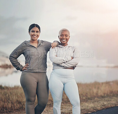 Buy stock photo Shot of two friends out for a workout together