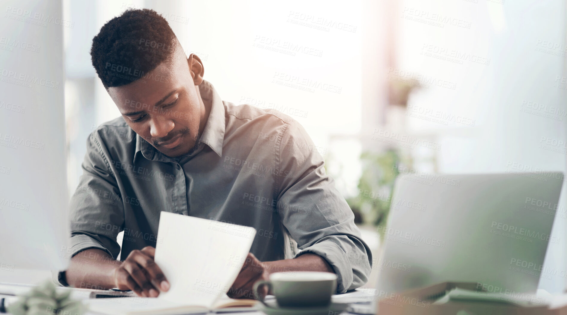 Buy stock photo Laptop, notebook and writing with business black man at desk in office for planning or review. Computer, journal and notes with professional employee in workplace for information or research