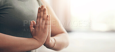 Buy stock photo Closeup shot of an unrecognisable woman meditating at home