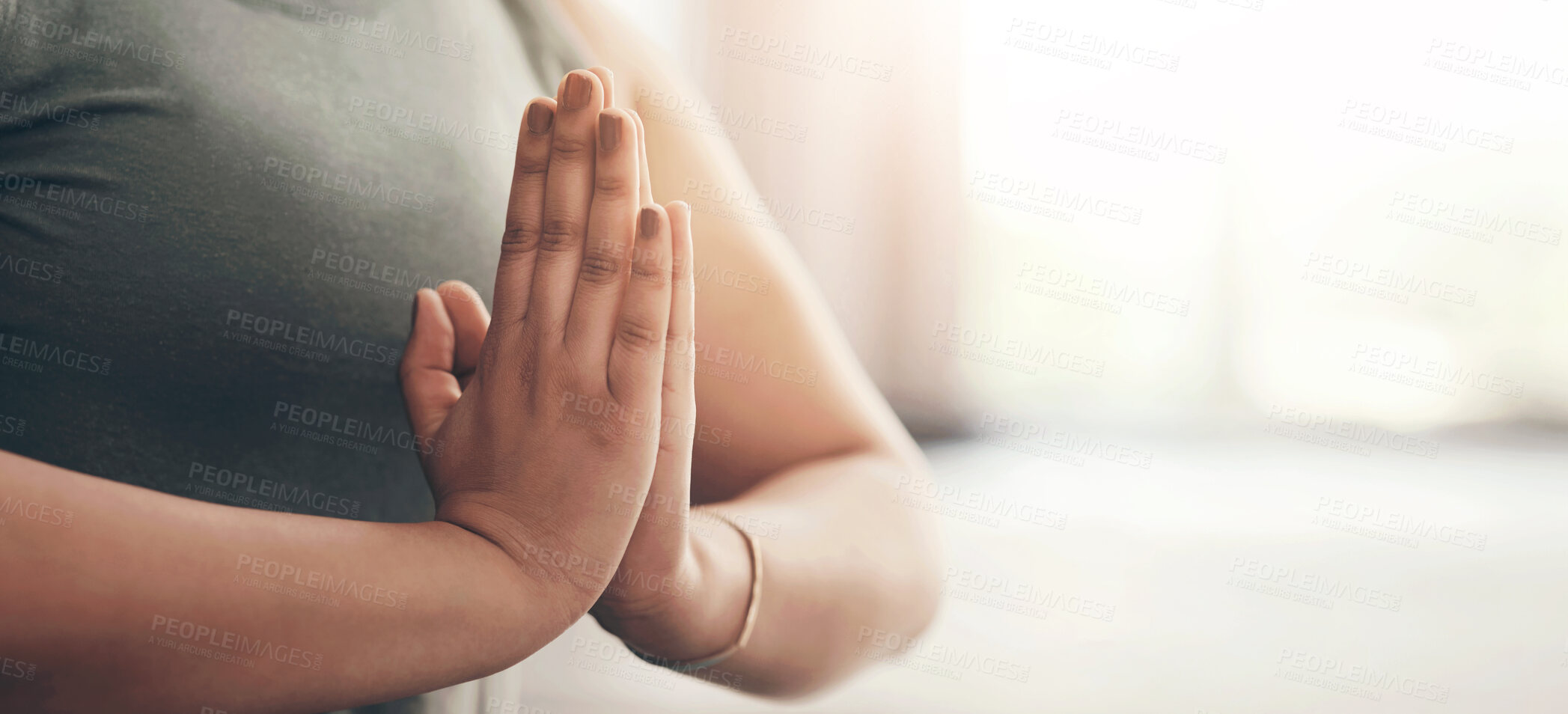 Buy stock photo Closeup shot of an unrecognisable woman meditating at home