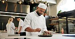 Man, chef and happy with food in kitchen at restaurant for fine dining, meal and creativity. Male employee, professional and cooker with smile for culinarily, hospitality and catering service