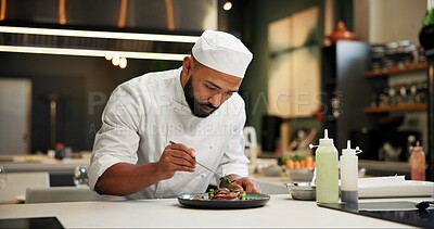 Buy stock photo Man, chef and serious with food in kitchen at restaurant for fine dining, meal and creativity. Male employee, professional and cooker with pride for culinarily, hospitality and catering service