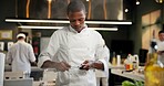 Black man, chef and serious with knife sharpener in kitchen at restaurant for fine dining, veg and creativity. Male employee, professional and cooker with food for culinary, hospitality and catering