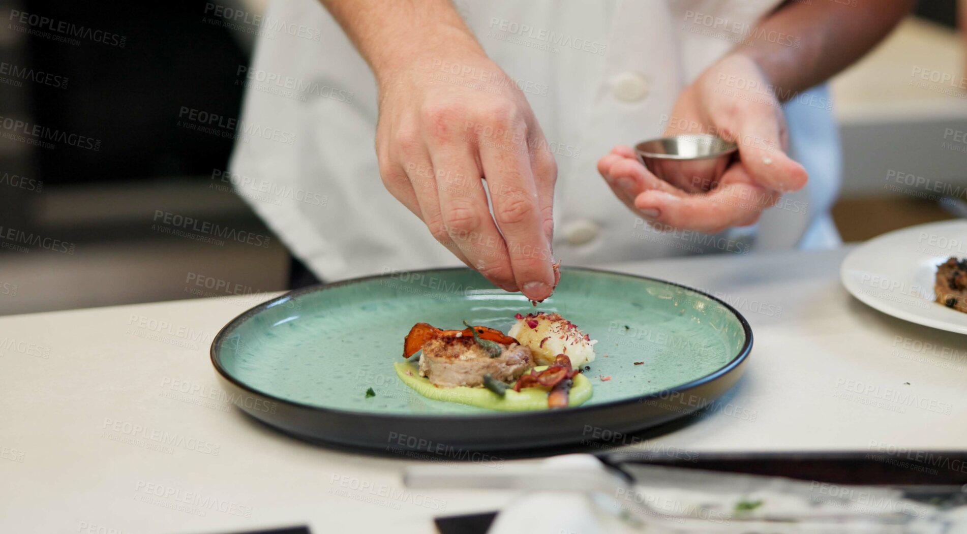 Buy stock photo Hands, food or sprinkle on dish for presentation, culinary personl or luxury restaurant. Chef, healthy protein or spices on plate for seasoning, fine dining and hospitality for mediterranean cuisine