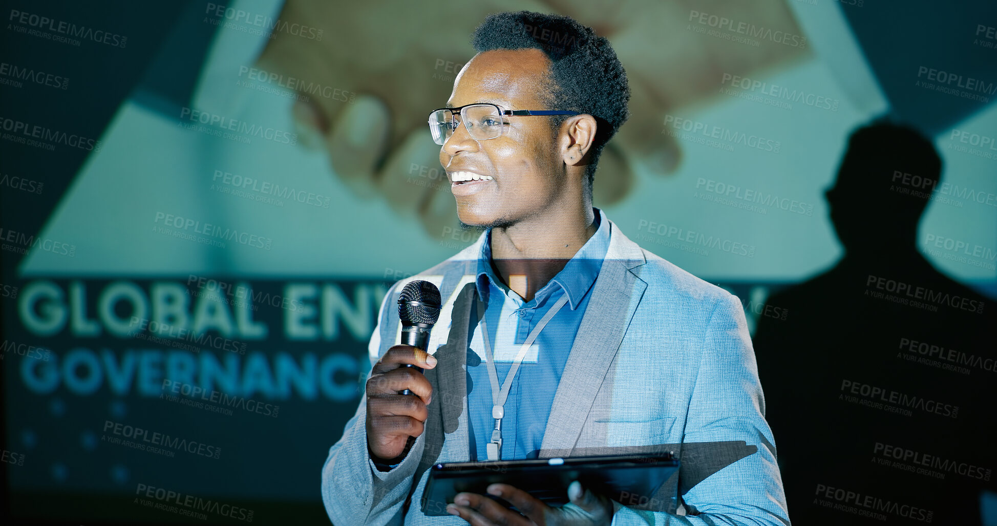 Buy stock photo Black man, conference and presentation with tablet for speech notes, information and discussion of convention. Smile, male presenter and digital education, audience and public speaking for training