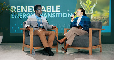 Buy stock photo Man, woman and discussion on stage at conference for renewable energy, solution and global policy. People, questions and talk in public debate for sustainability, future or plan of action for planet