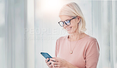 Buy stock photo Home, smile and senior woman with a smartphone, typing and connection for social media, website information and communication. Happy, mature female person and old lady with a cellphone and mobile app