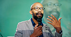 Conference, presentation or speech and public speaking man with microphone on stage for development seminar. Business, tradeshow and workshop with motivational speaker person in corporate auditorium
