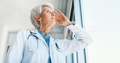 Buy stock photo Senior woman, doctor and fatigue in burnout, grief or mistake against glass window in hospital building. Frustrated physician, medical healthcare and person in stress, loss or headache at clinic