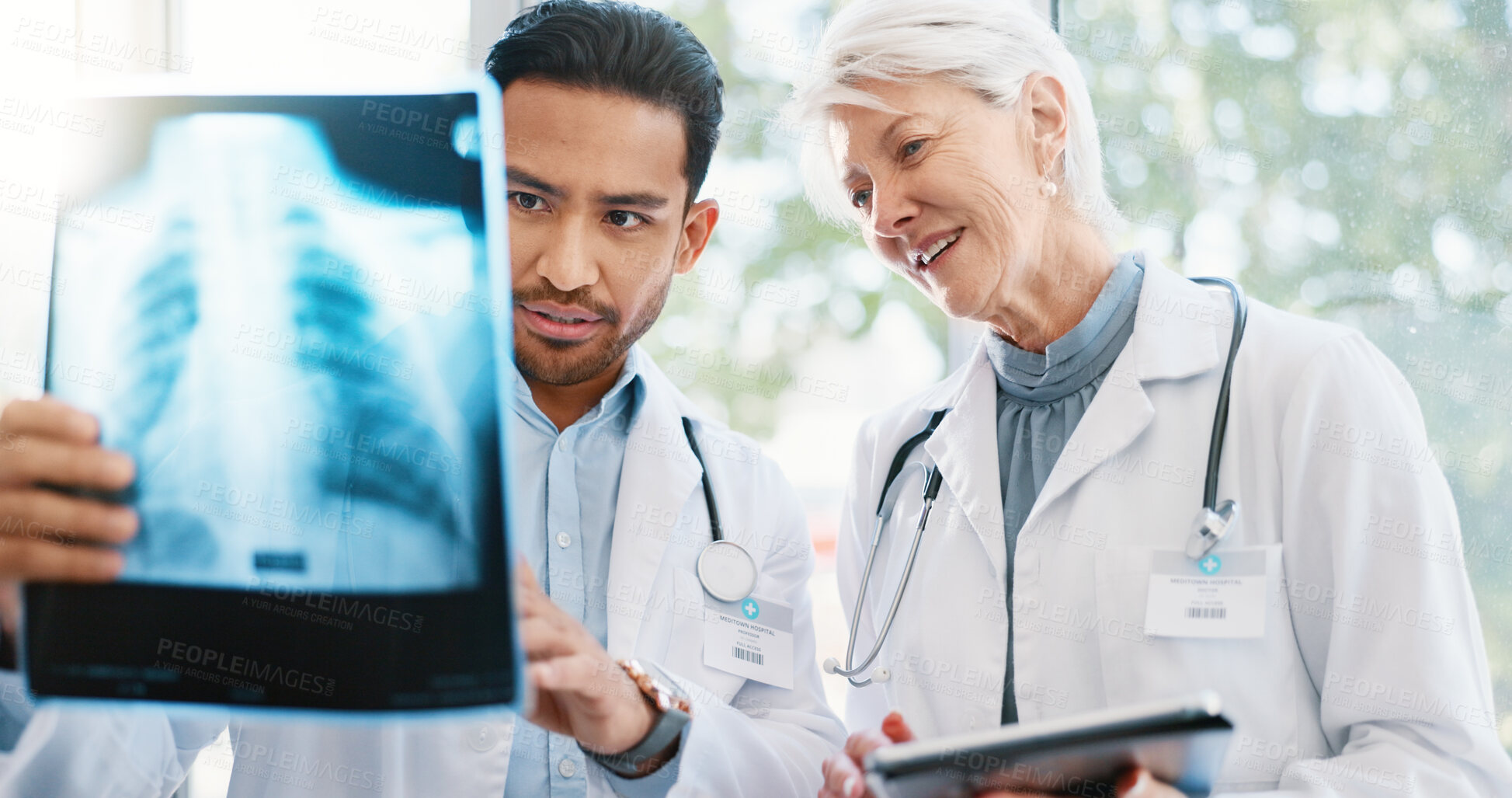 Buy stock photo Doctor, xray and medical analysis in hospital, professional consultation and people collaboration or results. Mature radiologist, tablet and research or chest diagnosis, wellness and film examination