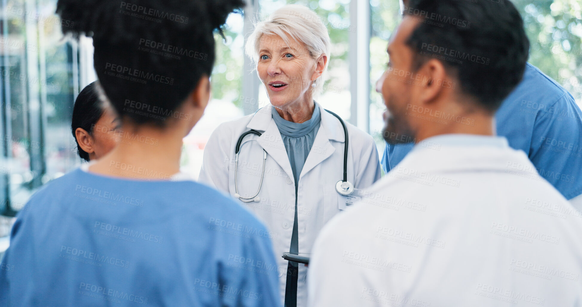 Buy stock photo Meeting, team and doctor with nurses in hospital for collaboration on medical diagnosis. Discussion, professional and healthcare mentor with cardiology students for feedback on internship in clinic.