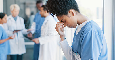 Buy stock photo African woman, nurse and headache in burnout, grief or mistake against glass window in hospital building. Frustrated physician, medical healthcare and person in stress, loss or fatigue at clinic