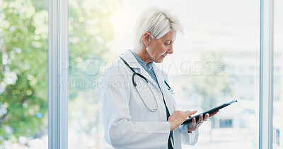 Buy stock photo Healthcare, tablet research and senior doctor for clinic management, checklist or digital results. Mature woman, professional person and medical technology with app for health, planning and solution