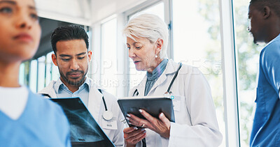 Buy stock photo Doctors, xray and medical analysis in clinic, professional consultation and teamwork collaboration for patient results. Mature radiologist, tablet and researching or diagnosis, people and hospital