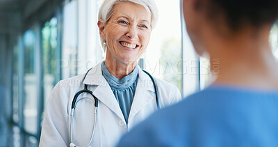 Buy stock photo Woman, doctor and smile with discussion in hospital for healthcare internship, advice and planning. Happy, mature professional and nurse with conversation in clinic for consulting, solution and help