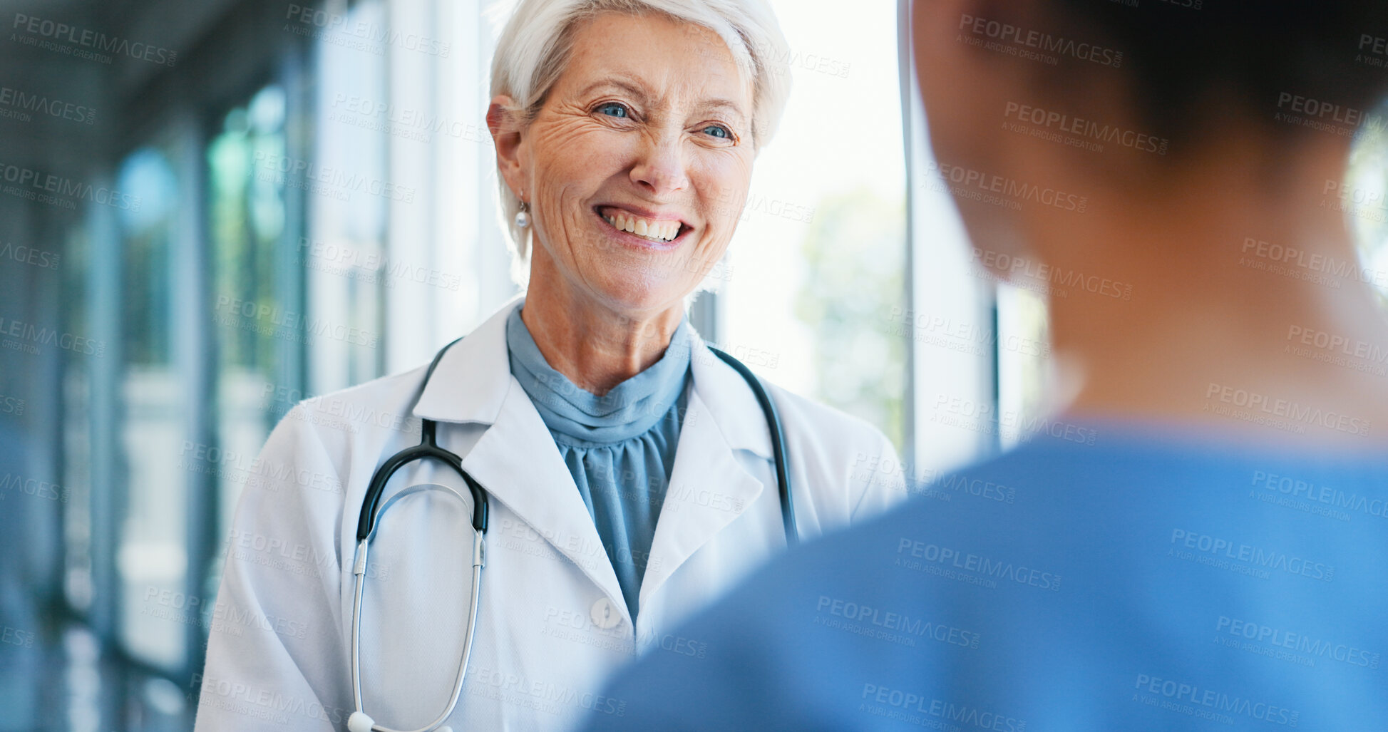 Buy stock photo Woman, doctor and smile with discussion in hospital for healthcare internship, advice and planning. Happy, mature professional and nurse with conversation in clinic for consulting, solution and help