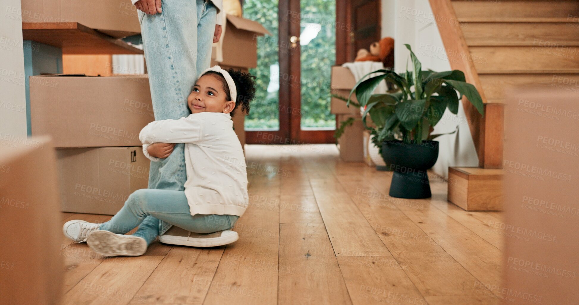 Buy stock photo Legs, new home and mother with girl, hug and happiness with expression, boxes and time together. Closeup, real estate and family with parent, daughter or real estate with cardboard, property or funny