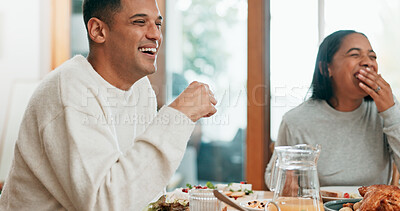 Buy stock photo Man, woman and laugh at family lunch in home, memory and joke with food, care or connection with smile. People, eating and happy couple with meal, reunion or holiday with  conversation in dining room