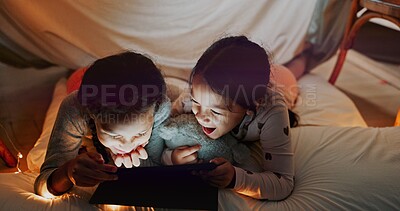 Buy stock photo Bedroom, girls and sisters with tablet, camp and internet for ebook, online games and social media. Home, tent and friends with tech, digital app for comedy movie and connection with comfort or night