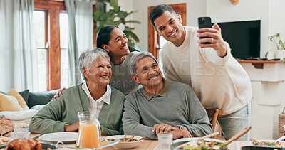 Buy stock photo Family, house and smile with selfie for lunch in table for memories, profile picture and social media. People, 
food and parents with bonding for love, support and care with thanksgiving gathering