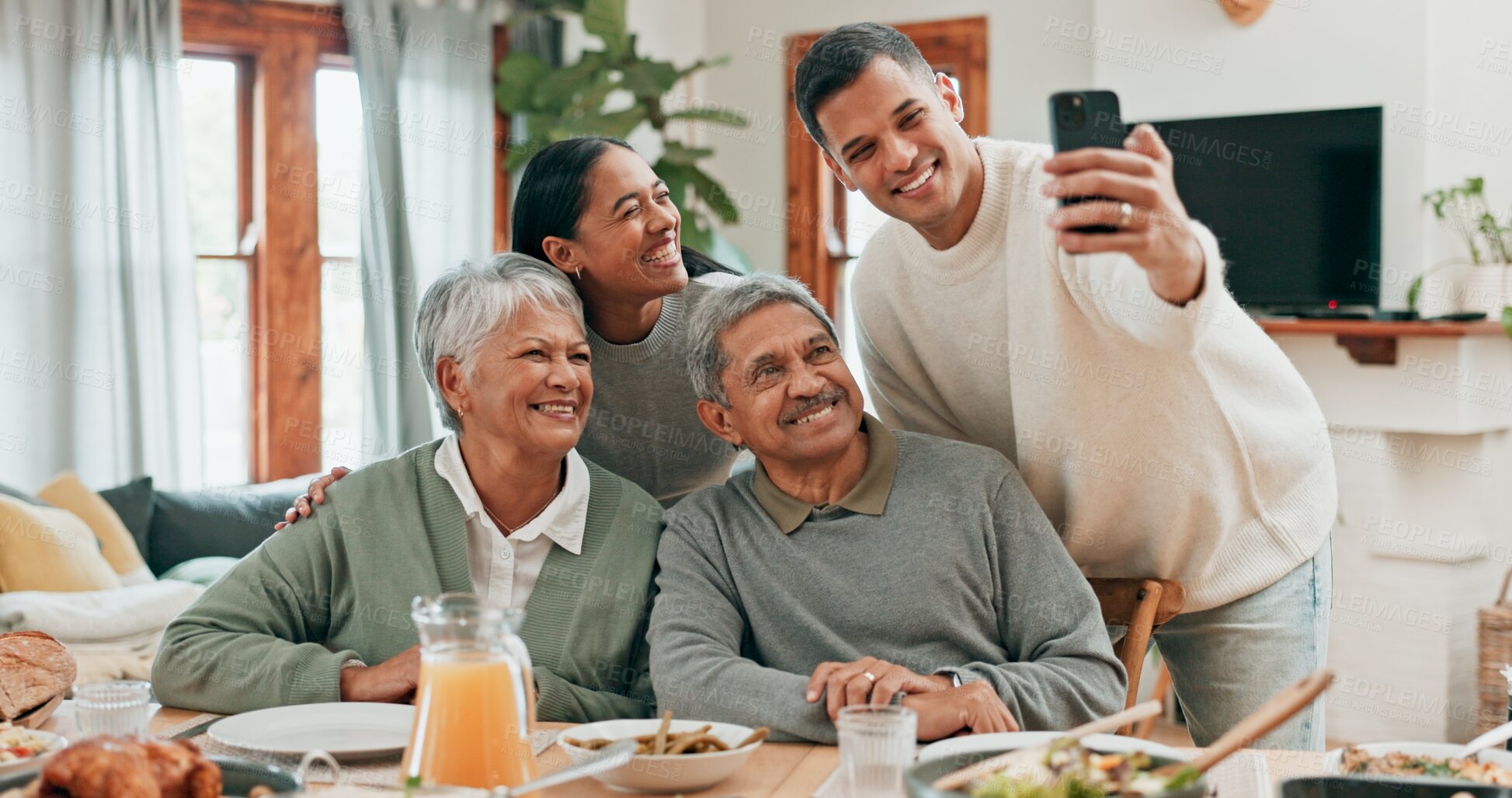 Buy stock photo Family, house and smile with selfie for lunch in table for memories, profile picture and social media. People, 
food and parents with bonding for love, support and care with thanksgiving gathering