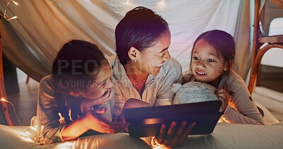 Buy stock photo Reading, night and tablet with family on bed in home together for bonding, love or storytelling. Education, learning or relax with mother and sister kids in bedroom of apartment for child development