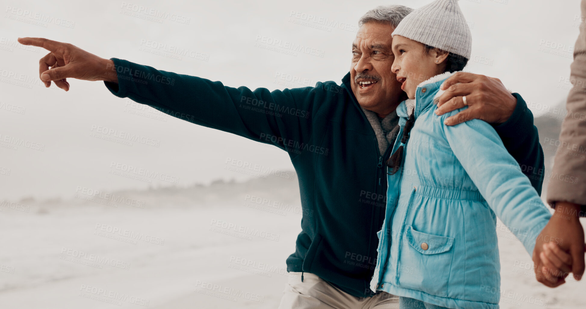 Buy stock photo Grandpa, child and beach with pointing, happy and family together on vacation by the sea with view. Love, smile and young girl with senior man outdoor in winter on holiday with retirement and travel