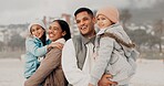 Parents, children and happy at beach in winter with hug, care and bonding with family memory on holiday. Father, mother and kids with love, connection and outdoor with smile on vacation in Mexico