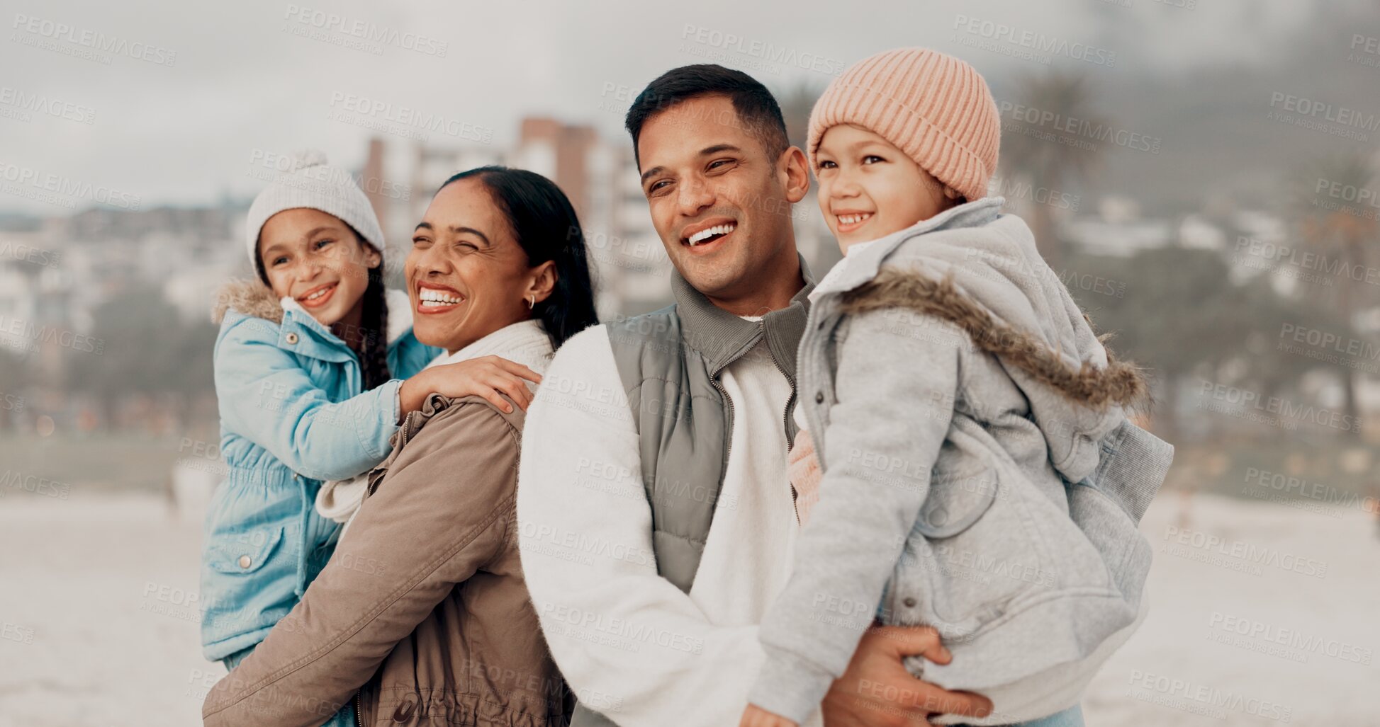 Buy stock photo Parents, children and happy at beach in winter with hug, care and bonding with family memory on holiday. Father, mother and kids with love, connection and outdoor with smile on vacation in Mexico