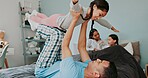 Airplane, playing and family in bedroom together for bonding on weekend morning at home. Happy, love and children having fun with lifting for flying and relaxing with parents on bed at house.