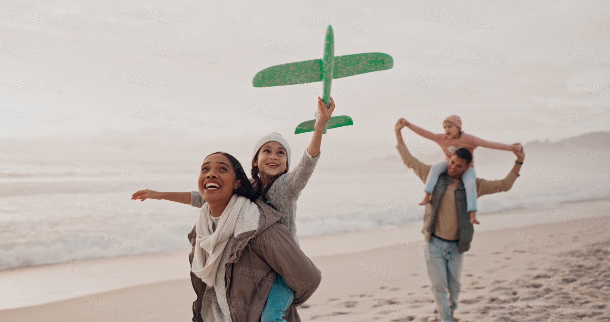 Buy stock photo Parents, kids and airplane on beach for play, fly fantasy and excited on vacation in Puerto Rico. Happy family, support and fun on seaside with trust, relationship development and energy on holiday