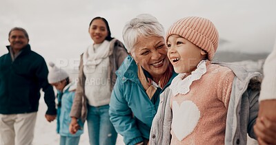 Buy stock photo Grandmother, girl and family at beach with smile, holding hands or outdoor with care, walk and vacation. People, generations and kids with laugh for funny conversation with bonding on winter holiday